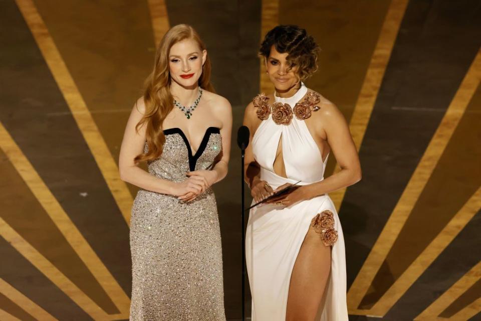 HOLLYWOOD, CALIFORNIA - MARCH 12: (L-R) Jessica Chastain and Halle Berry speak onstage during the 95th Annual Academy Awards at Dolby Theatre on March 12, 2023 in Hollywood, California. (Photo by Kevin Winter/Getty Images)