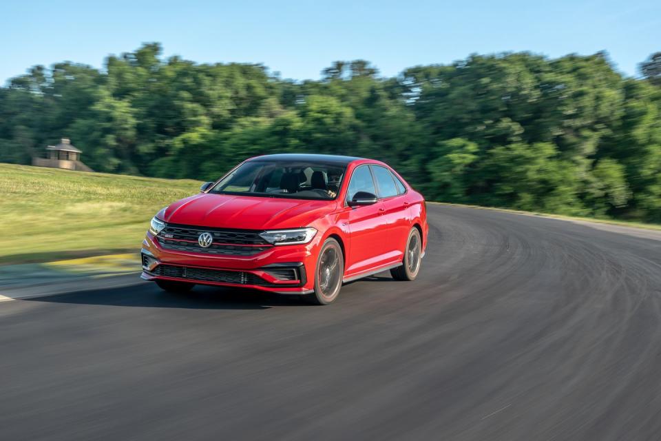 <p>Volkswagen puts its 228-hp turbocharged inline-four from the GTI into a four-door with a trunk. The <a href="https://www.caranddriver.com/volkswagen/jetta-gli" rel="nofollow noopener" target="_blank" data-ylk="slk:Jetta GLI;elm:context_link;itc:0;sec:content-canvas" class="link ">Jetta GLI</a> gets an electronically controlled limited-slip differential and 13.4-inch brake rotors from it too. Thanks to its 235/35R-19 Pirelli P Zero PZ4 tires, <a href="https://www.caranddriver.com/features/a29389451/2019-volkswagen-jetta-gli-lightning-lap-2019/" rel="nofollow noopener" target="_blank" data-ylk="slk:we were able to fling the GLI further into each braking zone;elm:context_link;itc:0;sec:content-canvas" class="link ">we were able to fling the GLI further into each braking zone</a> than even the Golf R. The miracles accomplished by its front differential give it torque when you need it the most, and its sticky tires grip long enough for you to actually use it. </p>