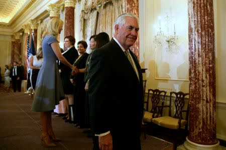 U.S. Secretary of State Rex Tillerson leaves as Ivanka Trump (L) greets award receptionists after the 2017 Trafficking in Persons Report (TIP) Ceremony at the State Department in Washington, U.S., June 27, 2017. REUTERS/Yuri Gripas