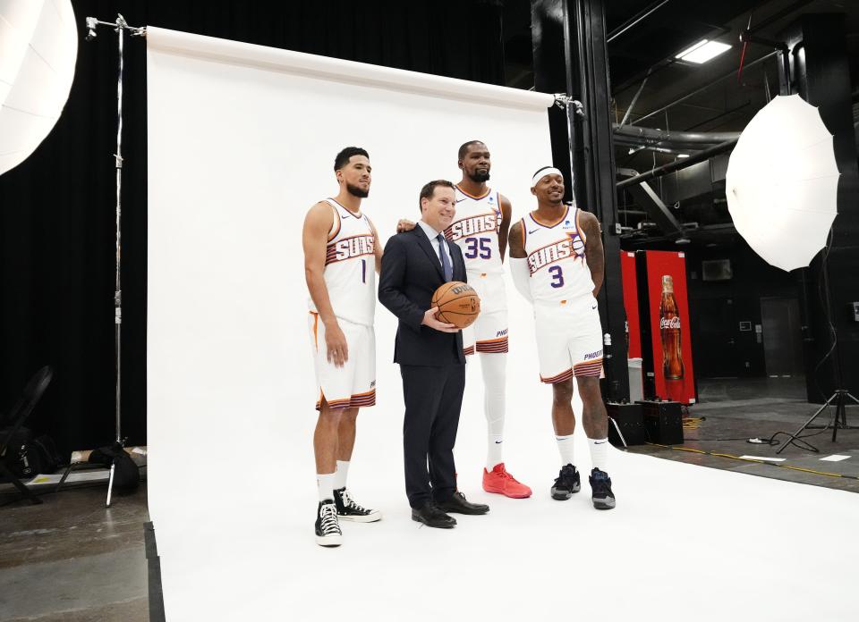 Phoenix Suns owner Mat Ishbia poses with Suns guard Devin Booker, forward Kevin Durant, and guard Bradley Beal during media day at Footprint Center in Phoenix on Oct. 2, 2023.
