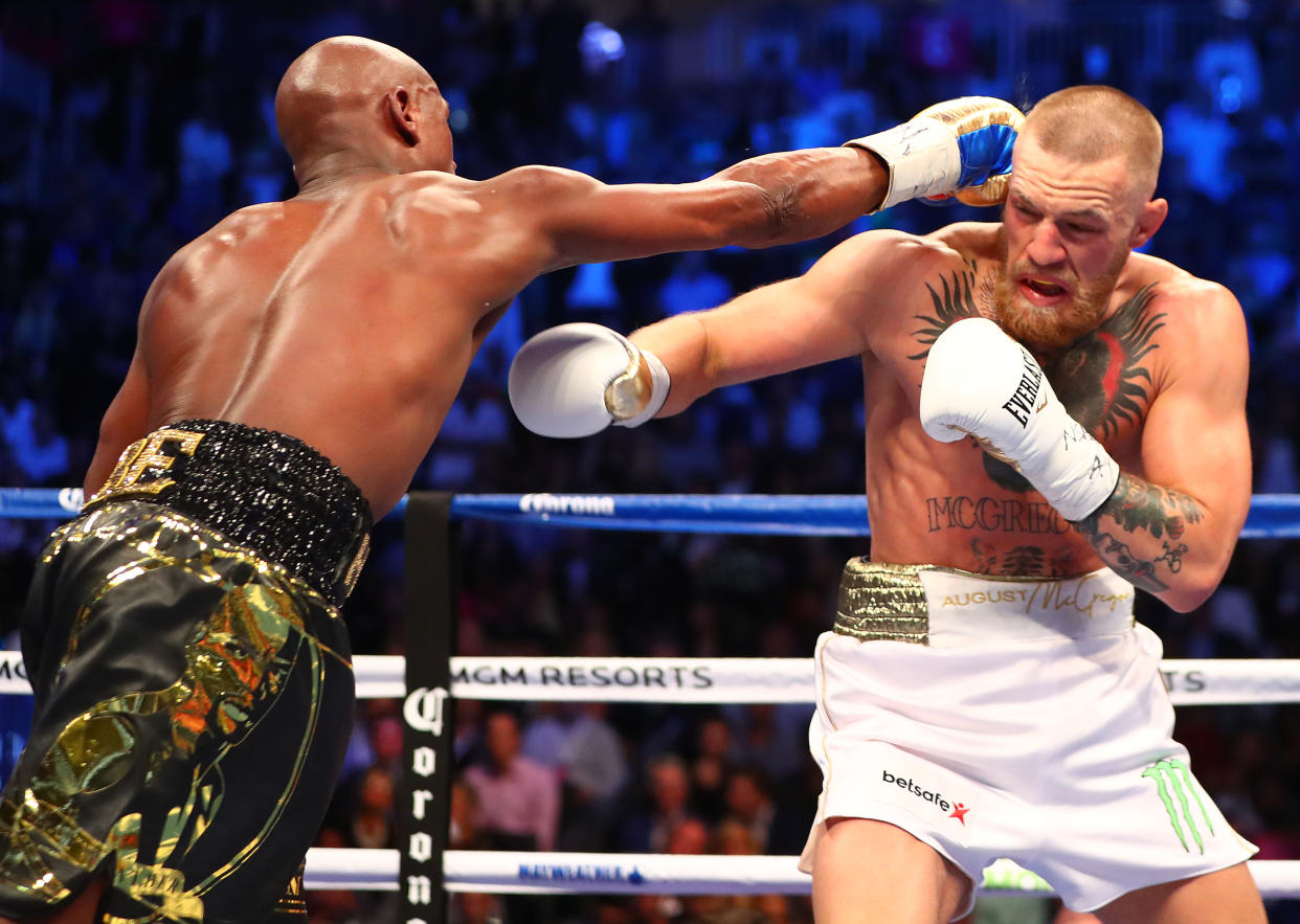 Aug 26, 2017; Las Vegas, NV, USA; Floyd Mayweather Jr. lands a hit on Conor McGregor during a boxing match at T-Mobile Arena. Mandatory Credit: Mark J. Rebilas-USA TODAY Sports