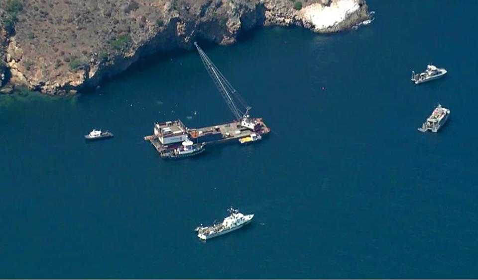 This photo from video provided by KABC-TV shows divers resuming their search Wednesday, Sept. 11, 2019 for the final missing victim who perished in a boat fire off the Southern California coast. The victim is one of 34 who died at sea last week near Santa Cruz Island when the dive boat Conception burned and sank on Sept. 2. Santa Barbara County Sheriff's Lt. Erik Raney says salvage efforts to recover the Conception also resumed Wednesday. (KABC-TV via AP)