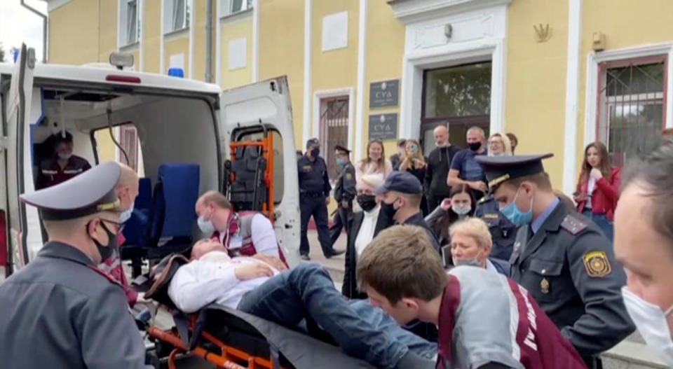 A still image taken from video footage shows Belarusian prisoner Stepan Latypov, who was arrested during a security crackdown on mass protests following a contested presidential election in 2020, being carried out of a court building after he stabbed himself in Minsk, Belarus, June 1, 2021. / Credit: Radio Free Europe/Radio Liberty/Handout via Reuters TV