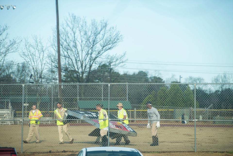 Crews remove a scoreboard following an EF-1 tornado at Buddy Watson Baseball Park in Montgomery, Alabama, on Jan. 4, 2023.