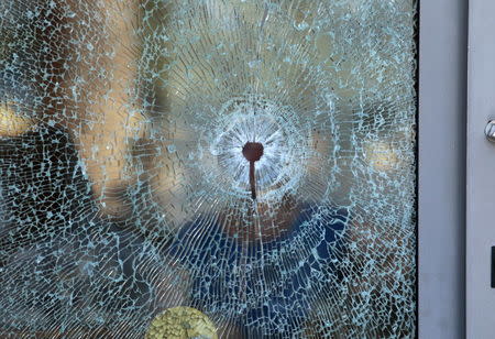 A broken glass window of the Imperiale Marhaba hotel is seen after a gunman opened fire at the beachside hotel in Sousse, Tunisia June 26, 2015. REUTERS/Zoubeir Souissi