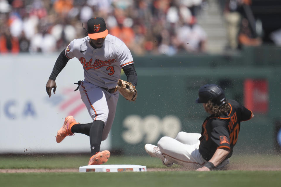 Baltimore Orioles shortstop Jorge Mateo (3) forces San Francisco Giants' Brett Wisely out at second base during the fifth inning of a baseball game in San Francisco, Sunday, June 4, 2023. (AP Photo/Jeff Chiu)