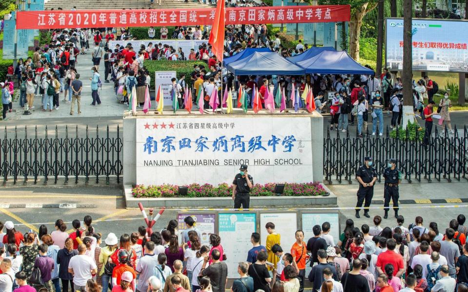 Students arrive at a school to sit the National College Entrance Examination in Nanjing, in China's eastern Jiangsu province - AFP