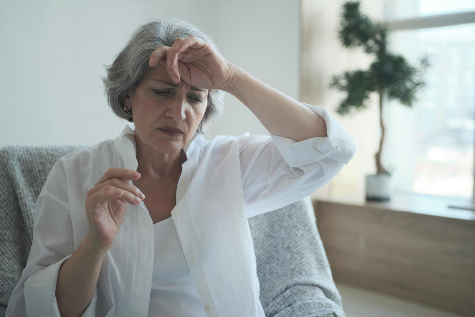 Pensive sad senior middle aged grandma worried depressed lonely at home from anxiety and solitude. Close-up terrified, disturbed older lady feeling scared and thinking of sickness or mental health