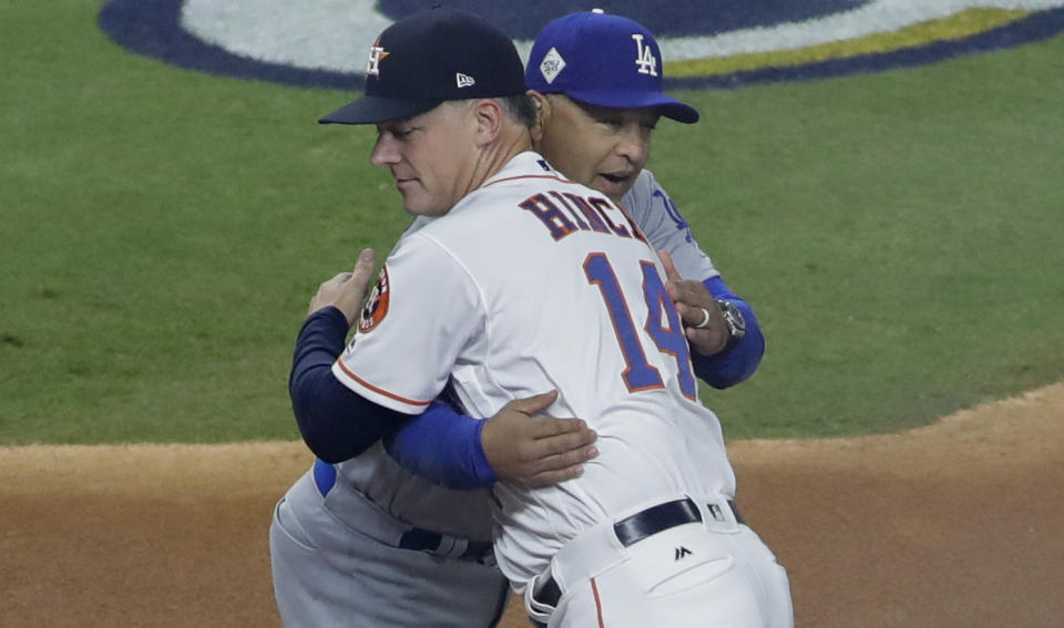 Dodgers manager Dave Roberts and Astros manager A.J. Hinch embrace before Game 3 of the 2017 World Series. (AP Photo)