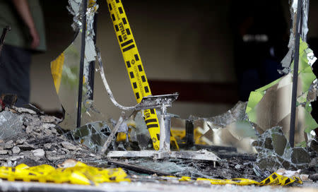 A burned chair is seen inside the building of the Congress, which was damaged after a demonstration against a proposed amendment that would allow Paraguay's president to stand for re-election, in Asuncion, Paraguay April 4, 2017. REUTERS/Jorge Adorno