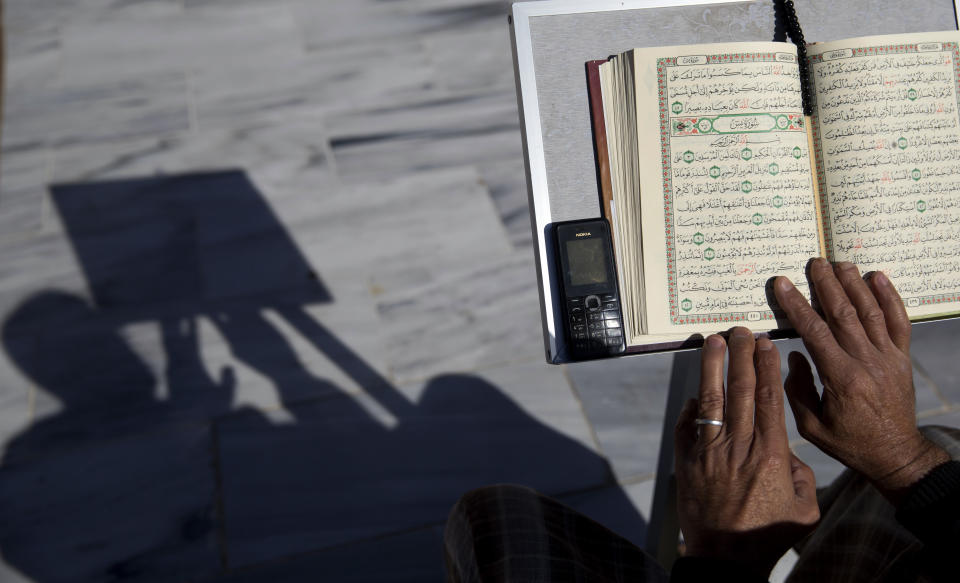 <p>A Palestinian man reads verses of the Quran, Islam’s holy book, during the month of Ramadan at Al Emari mosque in Gaza City, Wednesday, May. 8, 2019. Muslims throughout the world are preparing to celebrate Ramadan, the holiest month in the Islamic calendar, refraining from eating, drinking, smoking and sex from sunrise to sunset. (AP Photo/Hatem Moussa) </p>