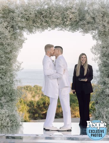 <p>HEATHER KINCAID PHOTOGRAPHER</p> Scott Hoying (left) marries Mark Manio as Christina Perri officiates