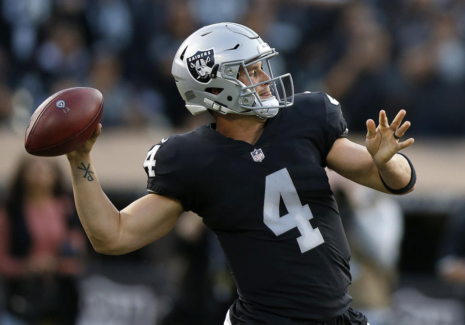 Oakland Raiders quarterback Derek Carr throws a pass against the Detroit Lions during the first half of an NFL preseason football game in Oakland, Calif., Friday, Aug. 10, 2018. (AP Photo/D. Ross Cameron)