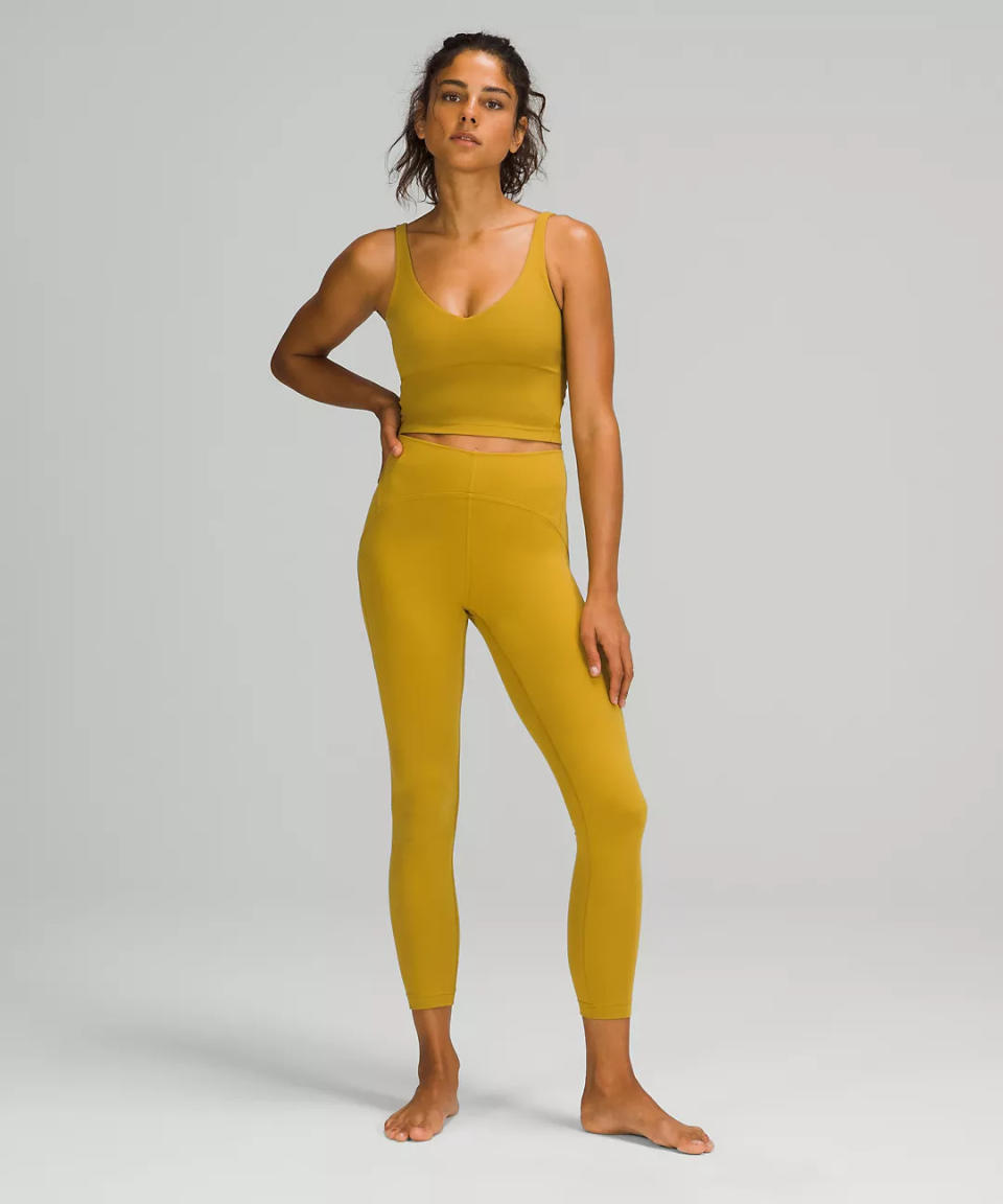 Instill High-Rise Tight in Auric Gold. Image via Lululemon.