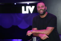 LIV owner David Grutman poses for a photograph at the nightclub, Wednesday, Oct. 14, 2020, in Miami Beach, Fla. LIV, one of Miami's most glamorous, star-studded nightclubs sits empty and quiet these days, a casualty of both the coronavirus outbreak and a power struggle between state and local government over how to contain the scourge. (AP Photo/Lynne Sladky)