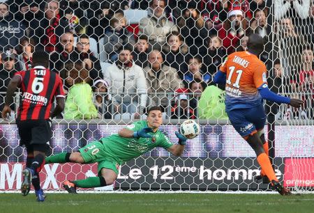 Football Soccer - Nice v Dijon - French Ligue 1 - Allianz Riviera stadium, Nice, France 18/12/16. DIjon's Julio Tavares scores against Nice's goalkeeper Yoan Cardinale. REUTERS/Eric Gaillard