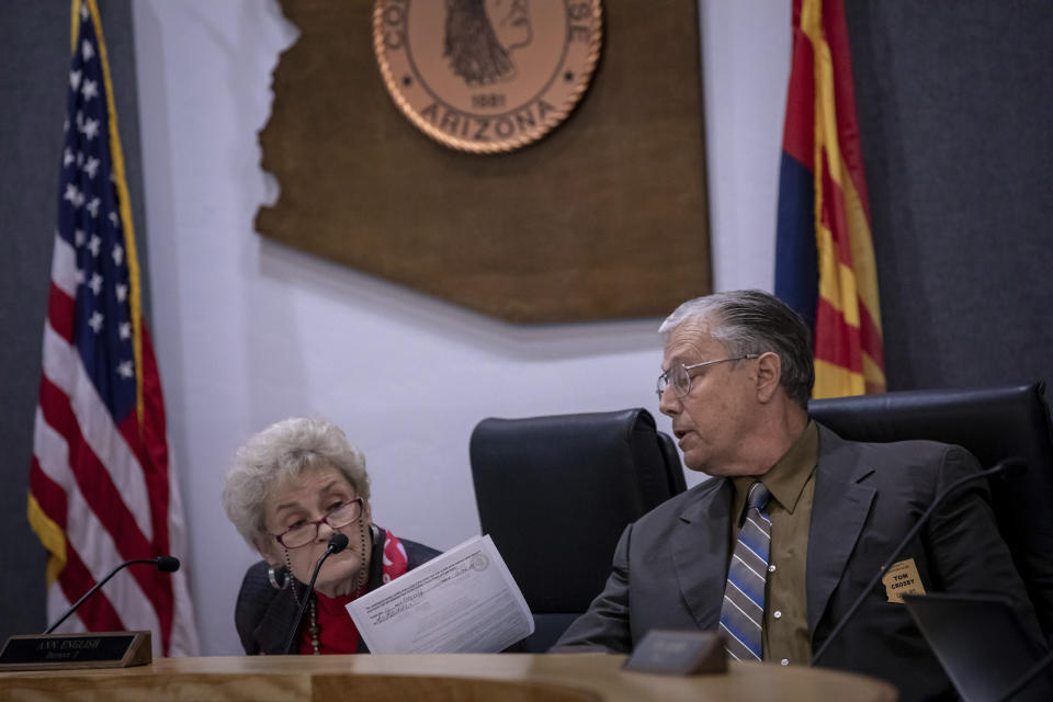 Cochise County Board of Supervisors Ann English, left, and Tom Crosby, right, discuss items on the public meeting agenda, Tuesday, Feb. 14, 2023, in Bisbee, Ariz. The Board of Supervisors convened to analyze and discuss the proposed transfer of election functions and duties to the county recorder. (AP Photo/Alberto Mariani)