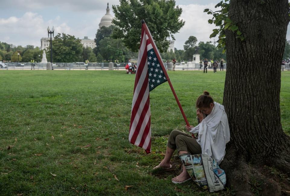 <div class="inline-image__caption"><p>Geraldine Lovell from Maryland cries under a tree during the “Justice for J6” rally.</p></div> <div class="inline-image__credit">Andrew Caballero-Reynolds/Getty</div>