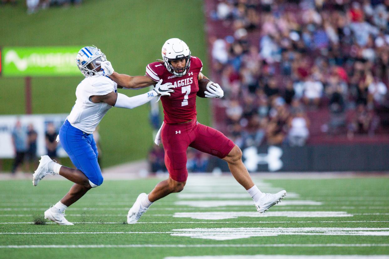 NMSU quarterback Eli Stowers runs the ball during the NMSU homecoming game on Saturday, Nov. 4, 2023, at the Aggie Memorial Stadium.