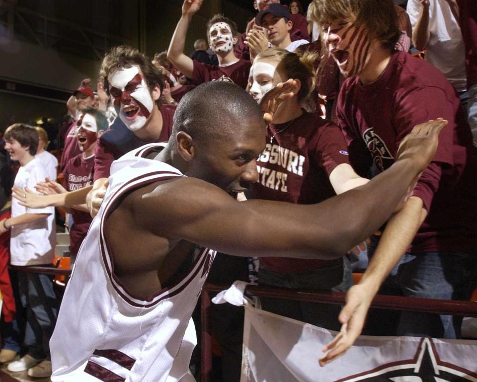 Missouri State's Deke Thompson high-fives fans after the Bears beat Drake Wednesday night at Hammons Student Center.