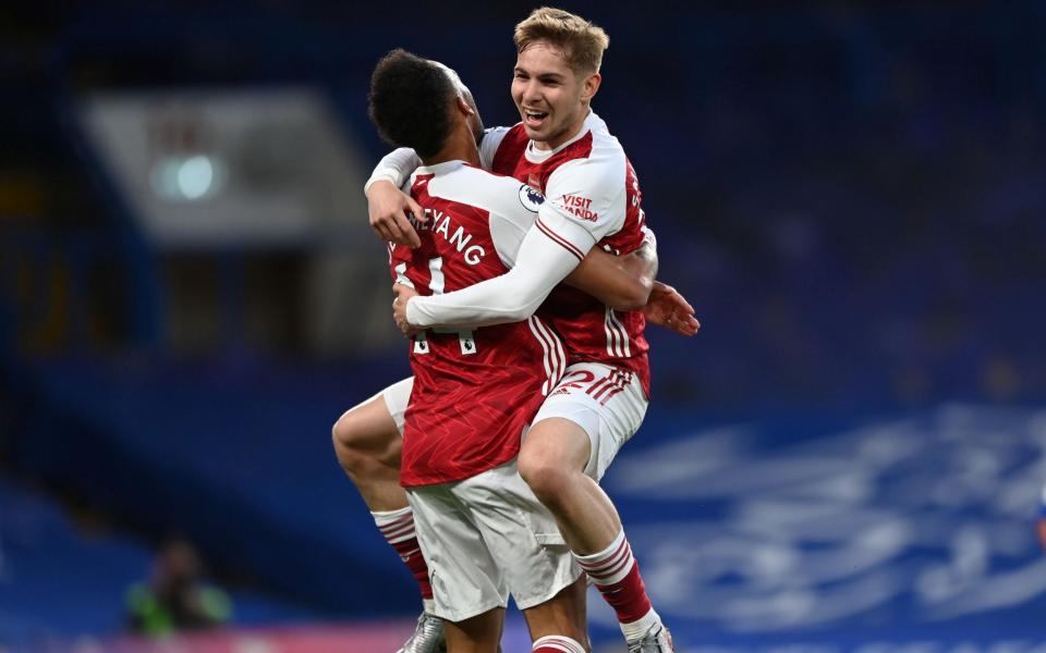 Arsenal's Emile Smith Rowe celebrates scoring their first goal with Pierre-Emerick Aubameyang - Pool via REUTERS 