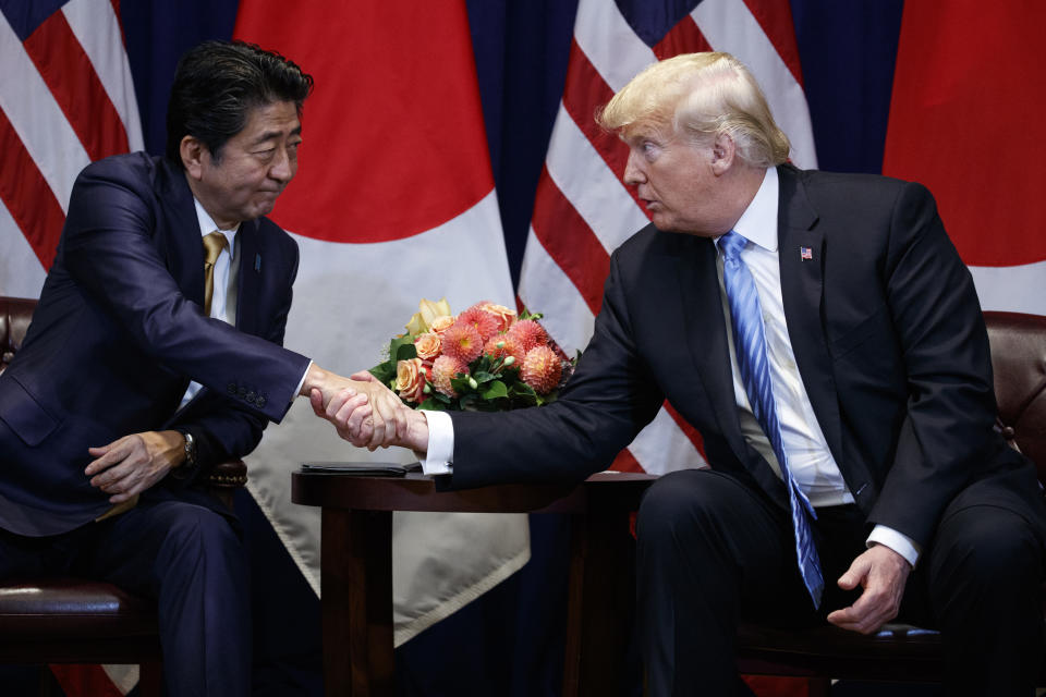 President Donald Trump shakes hands with Japanese Prime Minister Shinzo Abe at the Lotte New York Palace hotel during the United Nations General Assembly, Wednesday, Sept. 26, 2018, in New York. (AP Photo/Evan Vucci)