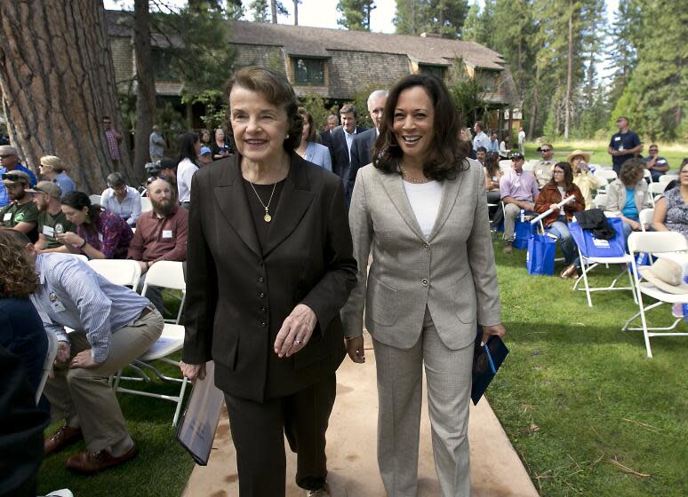 California's Democratic United States Senators, Dianne Feinstein, left, and Kamala Harris, walk together to speak at the 21st Annual Lake Tahoe Summit, Tuesday, Aug. 22, 2017, in South Lake Tahoe, Calif. The summit is gathering of federal, state and local leaders to discuss the restoration and to sustain Lake Tahoe.(AP Photo/Rich Pedroncelli)