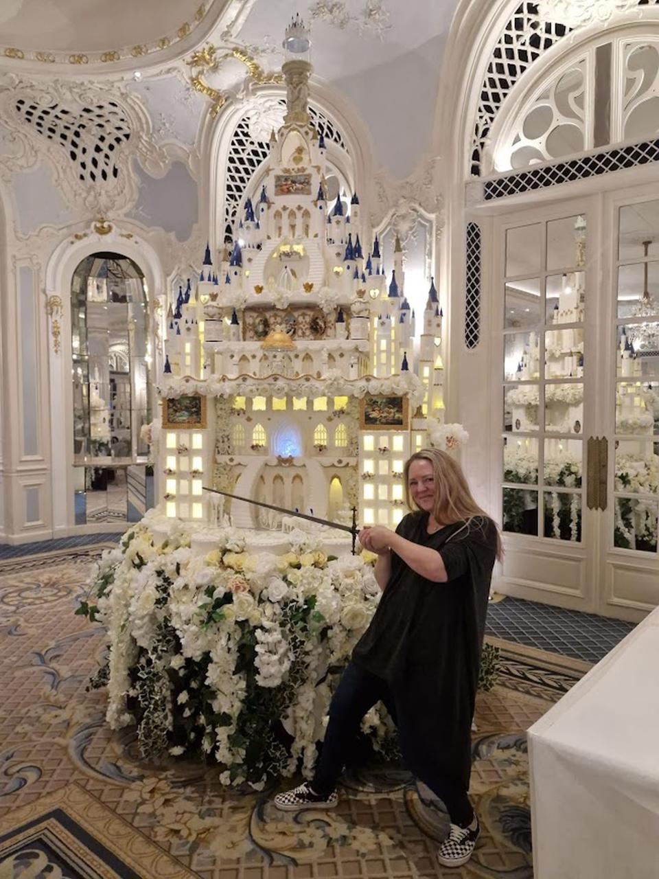 Sam Woodruff with the cake she designed. (Kennedy News)