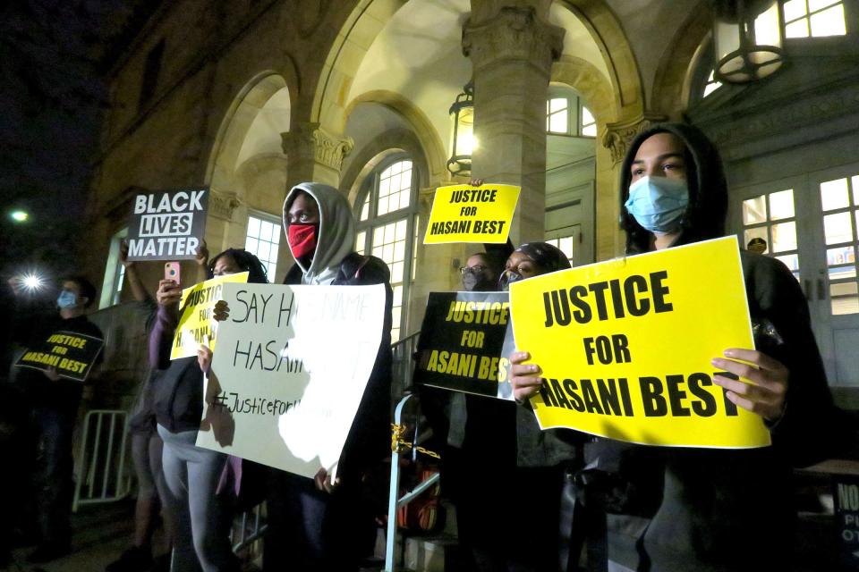 People gather outside the Post Office in Asbury Park for a rally Thursday evening, October 22, 2020,  to demand justice for the police involved shooting of Hasani Best in his city home.  Best's son Dayvon White is at left wearing red mask.