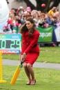 Kate doesn't look too pleased with her performance as she plays a game of cricket during a visit to Latimer Square in Christchurch in April 2014. She didn't let heels or a skirt stop her trying though. (Martin Hunter/AFP)