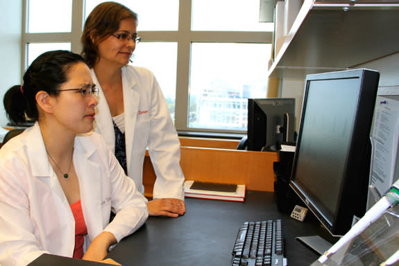 Joanne Turner, right, looks at data with graduate student Cynthia Canan at The Ohio State University Wexner Medical Center. Turner and her team recently discovered that daily doses of ibuprofen dramatically reduced inflammation in the lung cell