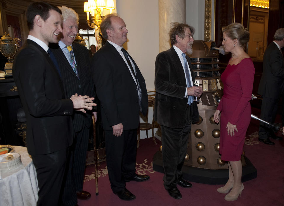 LONDON, ENGLAND - NOVEMBER 18:  Sophie, Countess of Wessex (R) meets past and present Doctor Who actors (L-R) Matt Smith, Tom Baker, Peter Davison and John Hurt during a reception to mark the 50th anniversary of the hit TV series at Buckingham Palace as british actor Peter Davison, the fifth incarnation of the Doctor role looks on, onNovember 18, 2013 in London, England. Sophie, Countess of Wessex hosted a reception to mark the 50th anniversary of the TV series in which there have been 11 Doctors to date. It now holds the Guinness World Record for the longest running science fiction series in the world.  (Photo by Eddie Mulholland - WPA Pool/Getty Images)