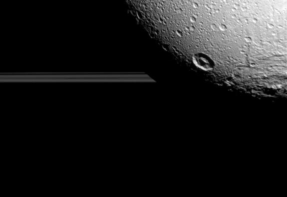 Saturn's moon Dione hangs in front of Saturn's rings in this view taken by NASA's Cassini spacecraft during the inbound leg of its last close flyby of the icy moon. The image was acquired on Aug. 17, 2015.