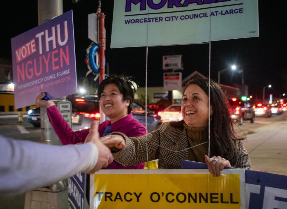 Thu Nguyen and Etel Haxhiaj campaign at the corner of Pleasant Street and Park Avenue Tuesday.