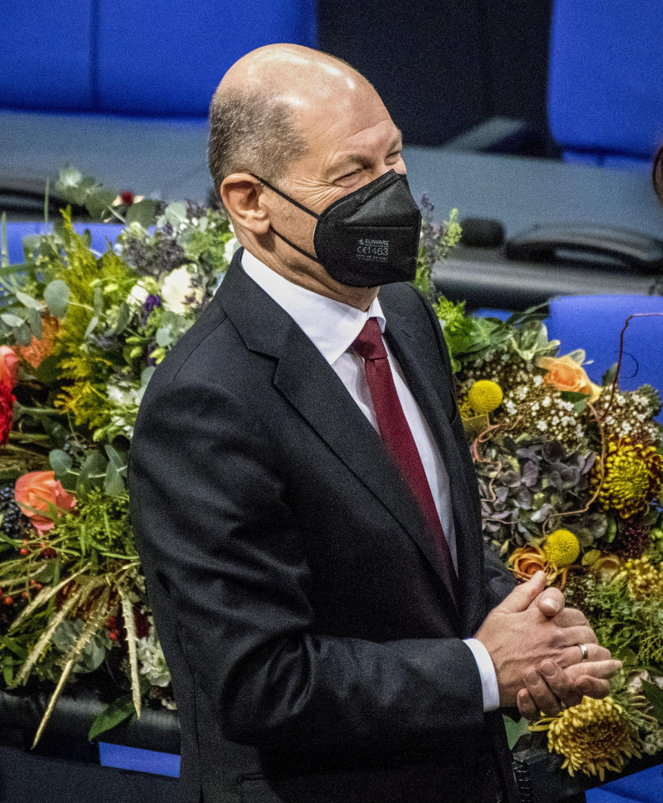 Olaf Scholz of the Social Democrats receives applause from lawmakers after he was elected new German Chancellor in the German Parliament Bundestag in Berlin, Wednesday, Dec. 8, 2021. The election and swearing-in of the new Chancellor and the swearing-in of the federal ministers of the new federal government will take place in the Bundestag on Wednesday. (Photo/Stefanie Loos)