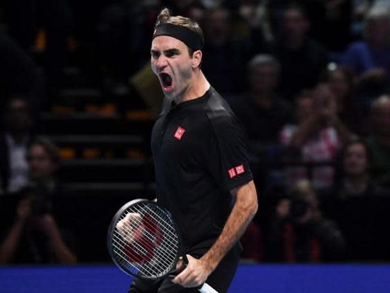 Roger Federer celebrates during the match (AP)