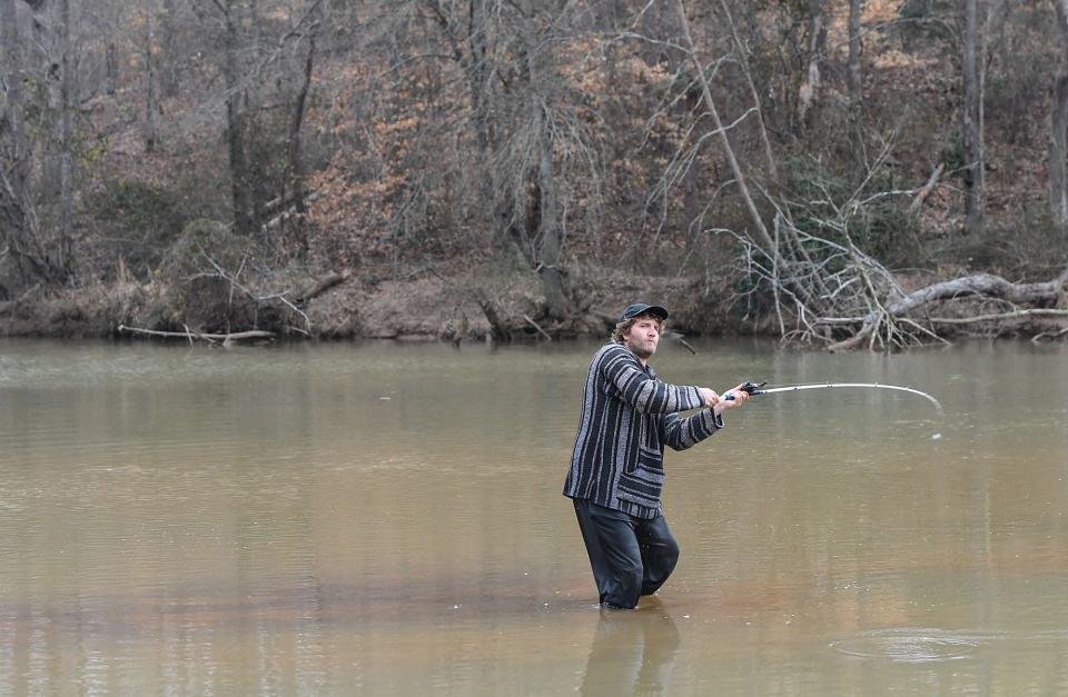 Andrew Wagner of Dacusville fishes in the Saluda River  near the land where Phase 1 of the Piedmont Riverfront Park project is, in Piedmont, S.C. Tuesday, January 31, 2023.  Thirteen recreation projects in South Carolina were the recipients of federal Land and Water Conservation Fund (LWCF) grants, including Phase 1 will have ADA-accessible kayak launch facility, 5,000 linear fee of ADA-accessible paved sidewalk, improved parking and access, and initial development of nature paths, shoreline access trails, and habitat enhancements, Anderson County presented in February 2022. 
