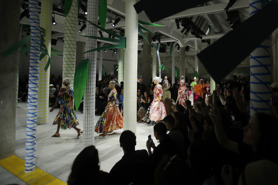 Models wear creations as part of the Marni Spring-Summer 2020 collection, unveiled during the fashion week, in Milan, Italy, Friday, Sept. 20, 2019. (AP Photo/Luca Bruno)