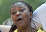 <p>A woman cries near the Grenfell apartment tower block in North Kensington, London, Britain, June 17, 2017. (Hannah McKay/Reuters) </p>