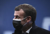 French President Emmanuel Macron arrives for an EU summit at the European Council building in Brussels, Thursday, Dec. 10, 2020. European Union leaders meet for a year-end summit that will address anything from climate, sanctions against Turkey to budget and virus recovery plans. Brexit will be discussed on the sidelines. (Yves Herman, Pool via AP)