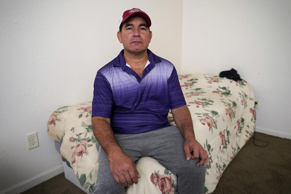 Rolando José Cisneros Borroto in his apartment, Friday, Aug. 26, 2022, in Algona, Iowa. (AP Photo/Charlie Neibergall)