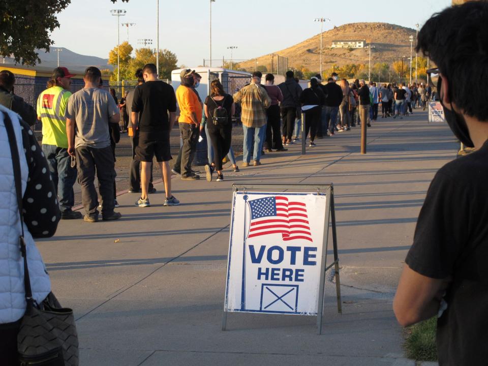 People line up to vote in Sparks, Nev., in November 2020.