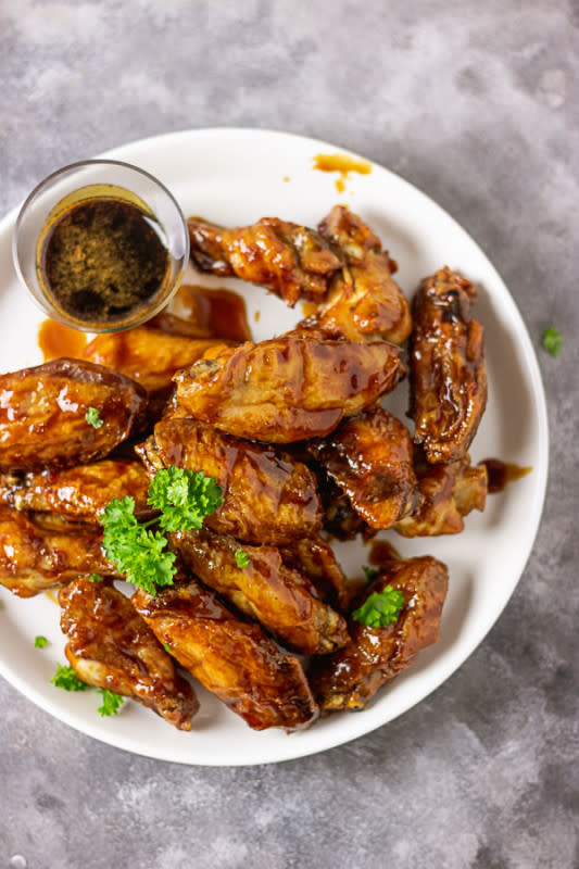 <p>My Active Kitchen</p><p>These sticky Asian chicken wings are not only sticky and sweet, but they are also crispy and fall right off the bones.</p><p><strong>Get the recipe: <a href="https://www.myactivekitchen.com/sticky-asian-chicken-wings/" rel="nofollow noopener" target="_blank" data-ylk="slk:Sticky Asian Chicken Wings;elm:context_link;itc:0;sec:content-canvas" class="link rapid-noclick-resp">Sticky Asian Chicken Wings</a></strong></p>