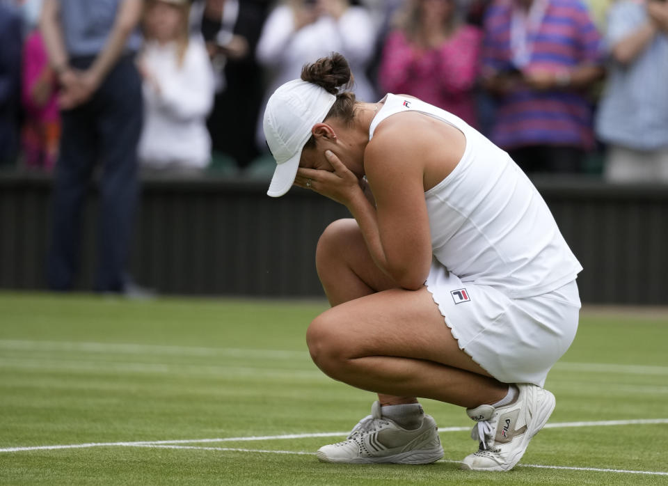 Australia's Ashleigh Barty reacts to the crowd after defeating the Czech Republic's Karolina Pliskova in the women's singles final on day twelve of the Wimbledon Tennis Championships in London, Saturday, July 10, 2021. (AP Photo/Kirsty Wigglesworth)