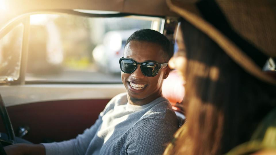 Shot of a handsome young man out on a road trip.