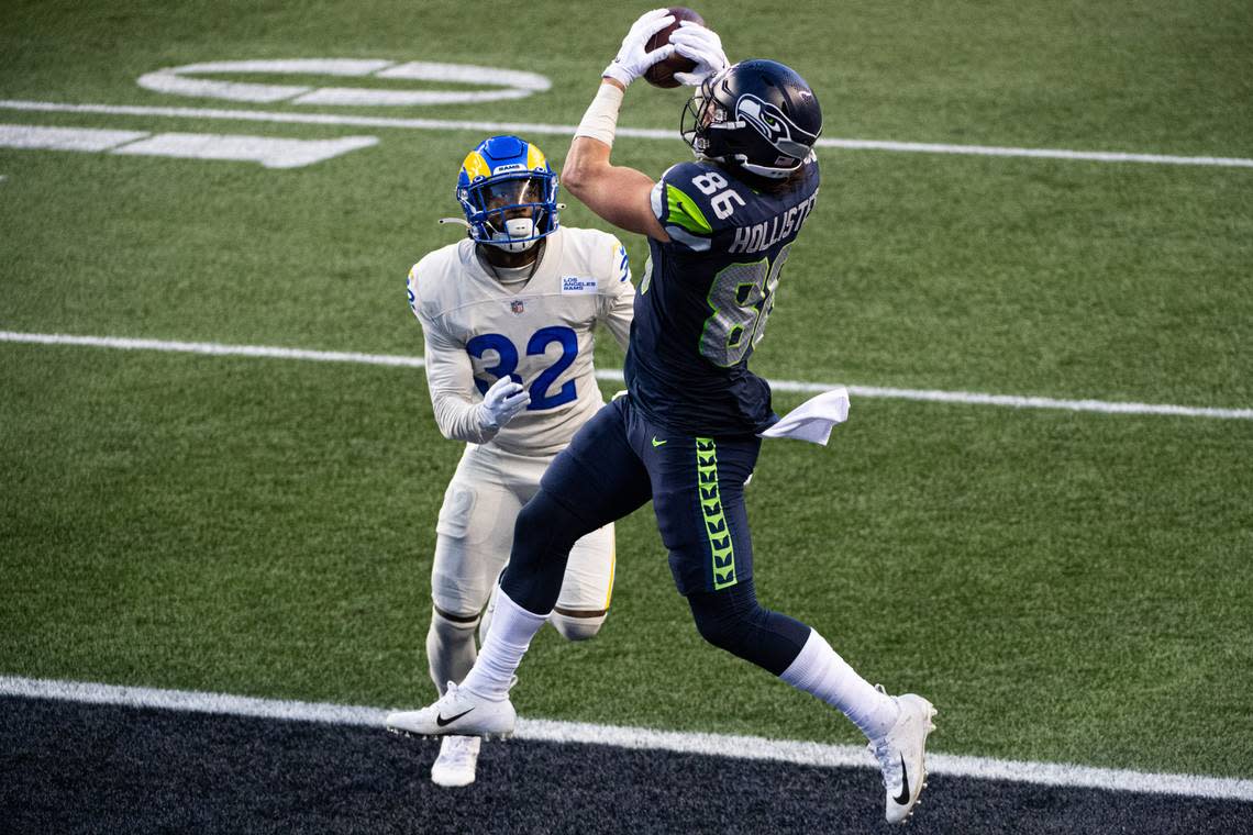 Seattle Seahawks tight end Jacob Hollister catches a touchdown pass over Los Angeles Rams cornerback Troy Hill during the fourth quarter. The Seattle Seahawks played the Los Angeles Rams in a NFL football game at Lumen Field in Seattle, Wash., on Sunday, Dec. 27, 2020. Joshua Bessex/jbessex@thenewstribune.com