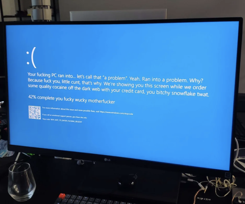Sad emoji with "Your fucking PC ran into, let's call that 'a problem,' why? Because fuck you, that's why; we're showing you this screen while we order some quality cocaine off the dark web with your credit card"