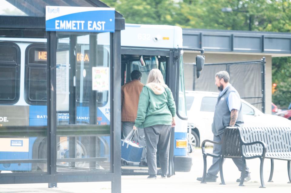 Passengers board the West Michigan bus at the Battle Creek Transit transfer station on Tuesday, Sept. 19, 2023.