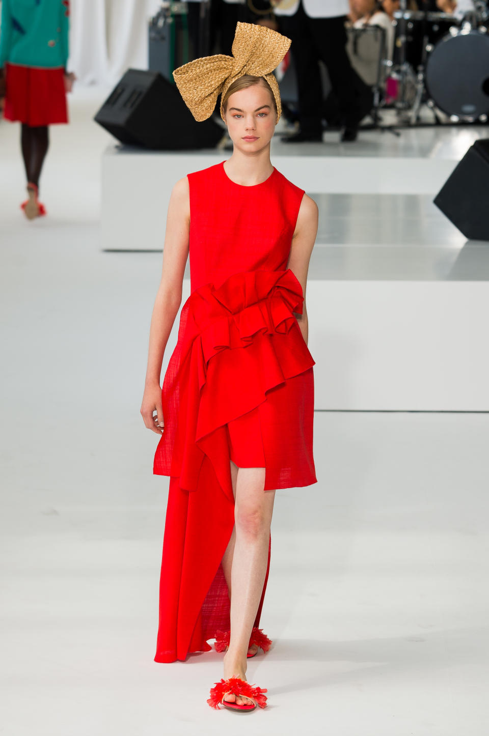 <p><i>Model wears a crimson, ruffle-tiered dress from the SS18 Delpozo collection. (Photo: ImaxTree) </i></p>