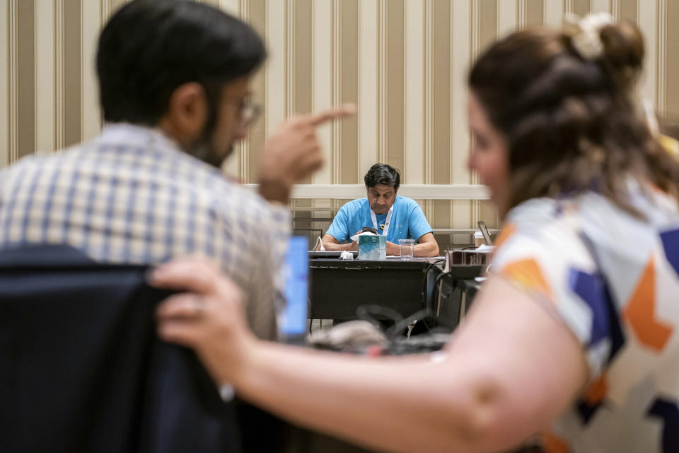 Members of the word panel debate proposed word definitions and sentence use during a meeting to finalize the 2023 Scripps National Spelling Bee words on Sunday, May 28, 2023, at National Harbor in Oxon Hill, Md. (AP Photo/Nathan Howard)